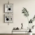 Two Abstract Paintings Hanging On Wall In Modern Interior With Green Plant And Decorative Sculpture