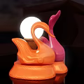 Orange And Pink Swan Shaped Table Lamps Illuminated On Dark Background