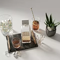 Elegant Wine Bottle And Glass Display On Marble Tray With Ice Cubes And Green Plant