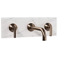 Brass Bathroom Faucet With Double Handles And Curved Spout On Marble Countertop