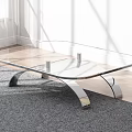 Modern Glass Top Coffee Table With Curved Metal Legs On Gray Carpet Wooden Floor