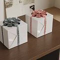 Decorative White Gift Boxes With Colored Ribbons And Bowknots On Wooden Table