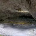 Scenic Natural Cave Landscape With Rocky Interior Formations And Open Entrance View