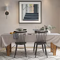 Dining Table Set With Tablecloth Black Chairs Wooden Legs And Flower Centerpiece