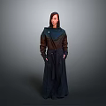 Stylish Woman In Long Dark Coat With Brown And Blue Panels And Pockets Standing