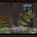 Serene Indoor Landscape With Lush Green Plants Misty Water And Decorative Stones