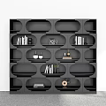 Modern Black Bookcase With Multiple Compartments Storing Books Decorative Items And Potted Plant