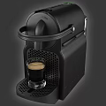 Black NESPRESSO Coffee Machine Making Coffee into Glass Cup Kitchen Appliance