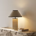 Table Lamp With Wooden Base Light Gray Lampshade On Patterned Surface With Books