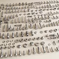 Various Metal Fasteners Including Screws Bolts Nuts And Washers Displayed