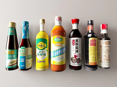 Various Kitchen Condiment Bottles With Different Labels Arranged Neatly On 3d model