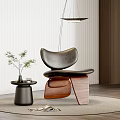 Black Leather Leisure Chair With Wooden Base And Small Table Under Pendant Light On Rug
