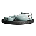 Elegant Celadon Ceramic Teaset With Teapot And Teacups On Black Tray