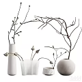 Display Of Multiple White Vases With Branches And Buds In Different Shapes