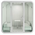 Small Private Lounge Space With Red Upholstered Casual Sofa Set And Transparent Glass Door