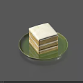 Delicious Square Layered Cake with White Cream and Frosting on Green Plate