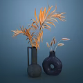 Textured Black Vase with Orange Leaves and Dark Hole Vase with Spike Flowers on Blue