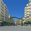 Ornate Green Archway Commercial Street With Yellow White Buildings Shops Pedestrians And Cars