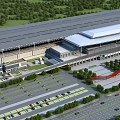 Modern Railway Station With Large Roof Structure Surrounding Greenery Parking Lots And Roads