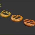 Salted Orange Pretzels Arranged In Row With Glossy Surface On Dark Background