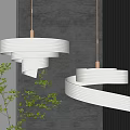 Modern White Spiral Pendant Lights With Warm Glowing Light Grey Wall And Green Plant Decor