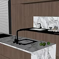 Modern Kitchen Sink With Brass Faucet On Marble Countertop And Fresh Green Limes