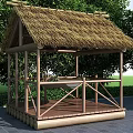Traditional Bamboo Pavilion With Thatched Roof Wooden Platform Surrounded By Green Trees And Grass