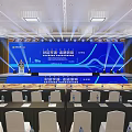 Professional Conference Hall Setup With Blue Backdrop Stage Podium And Seating Arrangement