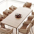 Rectangular Wooden Outdoor Table With Rattan Chairs And Tea Cups On Tray