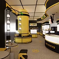 Modern Yellow Black Specialty Store Interior With Display Areas Shelves And Counter