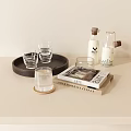 Stylish Clear Glass Cups on Wooden Tray with Decorative Books and Bottles