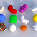 Various Colorful Shaped Soft Candy Items With Different Textures And Patterns