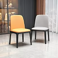Modern Orange and Gray Upholstered Dining Chairs with Black Legs in Room Interior