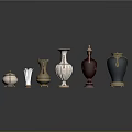 Carved Sculptural Vases With Various Colors And Ornate Decorative Details