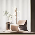 Beige Modern Single Sofa In Living Room With Brass Floor Lamp And Green Plant