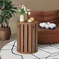 Round Wooden Stool In Living Room With Leather Sofa Vase Flowers And Green Plant