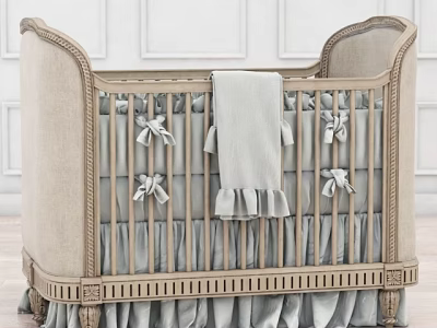 Classic Beige Upholstered Baby Crib With Bow Ties Soft Blanket And Ruffled Skirt 3d model