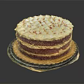 Layered Red Velvet Cake With White Frosting And Red Sprinkles On Plate