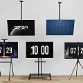 Multiple Televisions With Ceiling Mounts And Stands Showing Time And Date