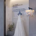 Elegant Bridal Window Display with Soulful Wedding Dress and Fresh Flower Bouquet