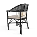 Stylish Natural Rattan Armchair With Red Geometric Cushion And Woven Accents