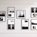 Stylish Photo Wall With Multiple Frames Featuring Black and White Landscape and Portrait
