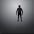 A Man Standing Against Dark Background Wearing Black Jacket Pants And Shoes