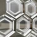 Transparent Hexagonal Display Units With Metal Frames On Grey Background And Concrete Floor