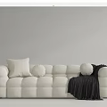 White Multi Seater Sofa With Rounded Block Design Decorative Pillows And Black Throw Blanket 3d model