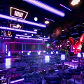 Modern Bar Interior Design With Neon Lights And Seating Area Lighting Effects