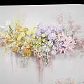 Elegant Floral Display With Wall Mounted And Floor Arrangements Featuring Pastel Yellow Purple Pink Flowers