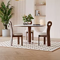 Round Table And Chairs Set With Wooden Frame Upholstered Seats Green Plants Bookshelf And Rug