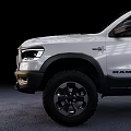 White Ram 1500 Crew Cab Pickup With Off Road Tires And Black Wheels