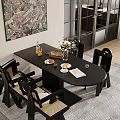 Black Oval Dining Table Set With Woven Chairs Flower Vase Food Items And Wall Art
